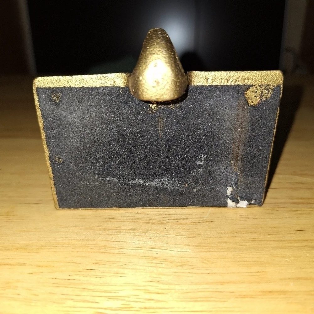 An unbranded Santa Clause Stocking Holder. Its base is 3.75